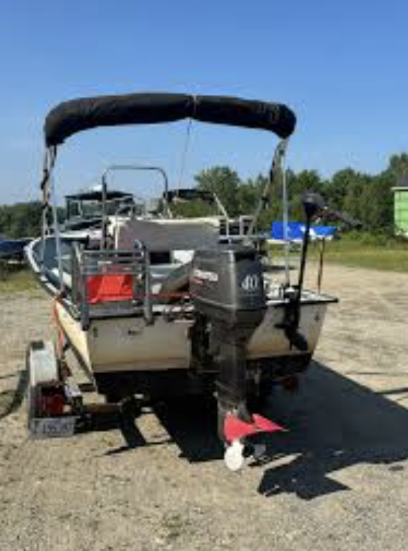 Boat with outboard motor ready for service